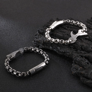 Detailed close-up of heavy stainless steel hip-hop chain with industrial tool pendant