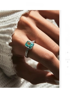 Close-up of S925 silver ring with rectangle Paraiba stone and pavé diamonds
