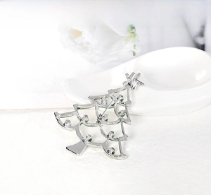 Detailed back view of a Christmas tree brooch showing the secure rotating pin clasp