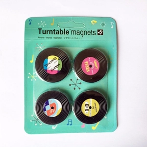 Set of 4 vintage vinyl record fridge magnets with retro turntable designs and musical themes