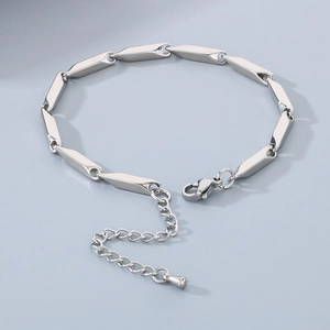 Detail of silver rhodium-plated bar link bracelet with lobster clasp and extender