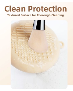 Close-up of beige silicone makeup brush cleaning mat with textured surface and foam