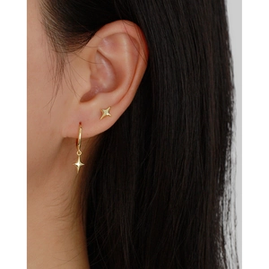 Minimalist gold S925 sterling silver four-pointed star stud and hoop earrings on model