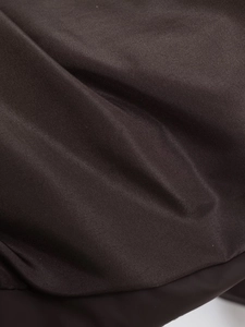 Close-up of thick dark brown woven fabric showing high-density texture and warm material