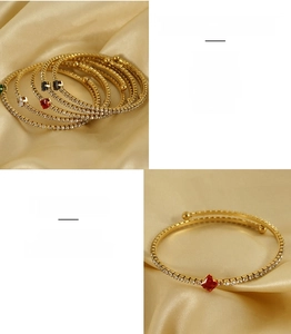 Detail of adjustable 18K gold plated stainless steel zircon bangle with sandblasted finish