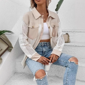 Close-up of beige and white panelled jacket featuring intricate crochet lace sleeves and pockets