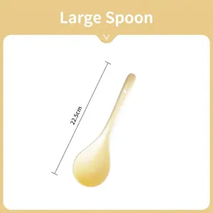 Detail view of a 22.5cm long beige ceramic spoon with a hanging hole on the handle