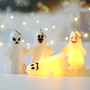 Set of four ghost LED keychains with glowing expressions for Halloween party decor