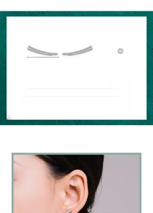 Detail view of 925 sterling silver ear crawler earrings with cubic zirconia on a model