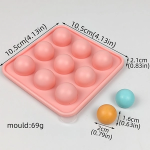 Pink 9-cavity silicone sphere mold with dimensions 10.5x10.5x2.1cm and 69g weight