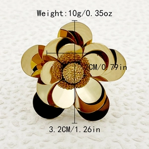 Detail view of gold flower ring with 3.2cm diameter and 2cm height dimensions