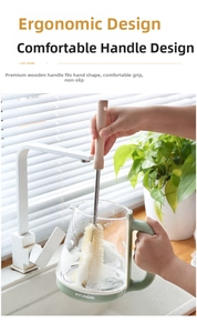 Ergonomic wooden handle cup brush cleaning the inside of a green glass kettle