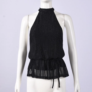 Detail of black halter top featuring silver stripe texture and waist tie design