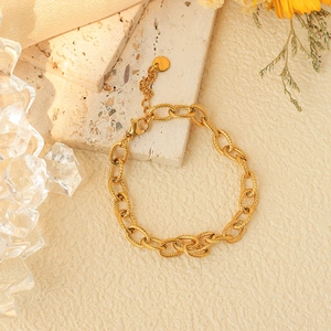 Elegant gold plated stainless steel bracelet with textured twist links and lobster clasp