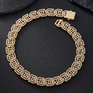 Iced out gold Cuban link bracelet with H initial letter and sparkling pavé crystals