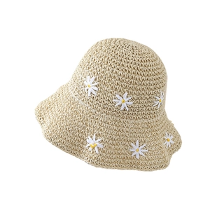 Handwoven beige straw sun hat with white daisy embroidery for summer beach vacation