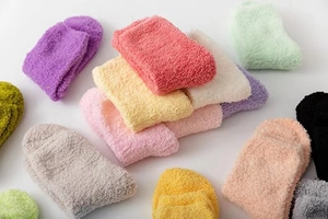 Close-up of thick multi-color coral fleece winter socks in a soft textured pile