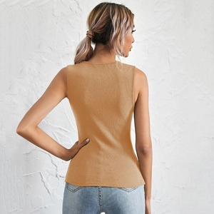 Back view of a ginger yellow ribbed knit tank top showing fabric texture on a female model