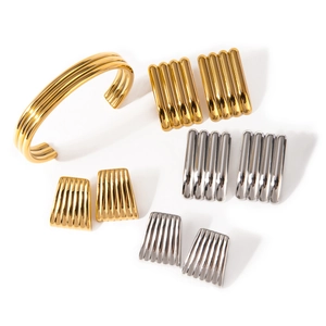 Polished 18k gold and silver stainless steel jewelry set with ribbed cuff and earrings
