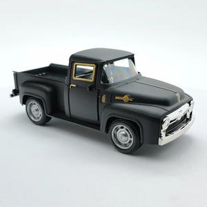 Detailed side view of a vintage black alloy pickup truck model with silver accents