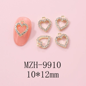 Detailed view of gold hollow heart nail charm with pavé rhinestones in 10x12mm size