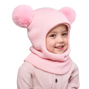 Detailed knit texture and soft faux fur pom-poms on the pink baby balaclava hat