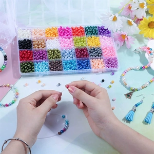 DIY jewelry making kit with 28 colors of 6mm ABS pearls in a 24-grid organizer box
