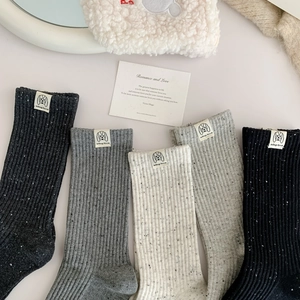 Five pairs of casual knit mid-calf socks in grey tones with stylish adog love labels