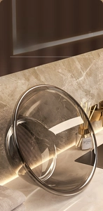 Close-up of translucent grey luxury washbasins with smooth edges on marble countertop