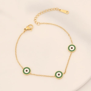 Detail of adjustable gold chain bracelet featuring three colorful enamel evil eye charms