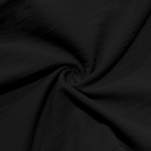 Texture macro du tissu noir respirant en coton et lin avec détails de plis souples