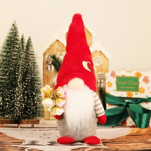 Detail of a red holiday gnome holding fabric flowers with a Sweet Love gift box background