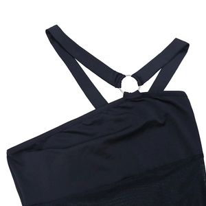 Close-up of black dress with asymmetrical strap, silver metal ring and mesh paneling