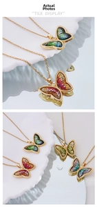 Detail view of 18K gold plated butterfly pendant with vibrant gradient glitter inlay