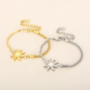 Detail of sun charm bracelets in gold and silver finish with adjustable lobster clasp