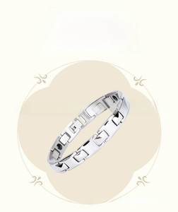 Detailed macro view of the inner magnetic germanium stones on polished stainless steel bracelet