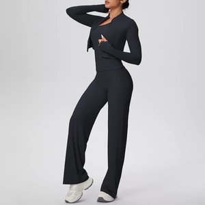 Detailed view of women black three-piece yoga set with jacket, vest and wide-leg pants