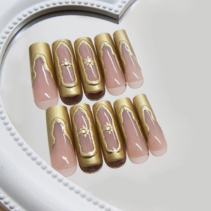 French star press on nails in gold and nude pink with rhinestones and 3D relief design