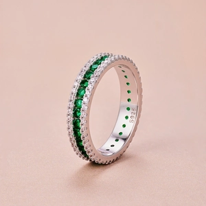 Detailed macro view of S925 sterling silver ring with green and white zircon stones