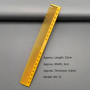 Macro detail of yellow barber comb with measurement scales and hollow grip design