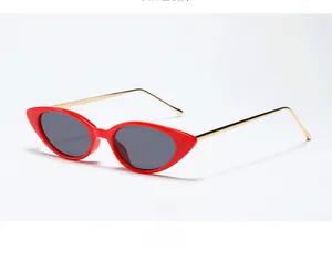 Cat eye sunglasses with red frames and gold metal temples shown from a 45-degree angle