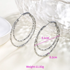 Detailed view of silver hoop earrings with chain texture showing 5.1cm diameter size