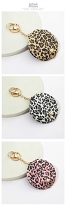 Three leopard print PU leather keychain mirrors in gold, gray, and pink colors