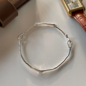 Elegant S925 sterling silver irregular branch bangle with a minimalist natural texture