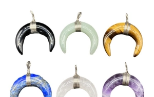 Detailed grid view of wire-wrapped crescent moon pendants in various natural gemstones