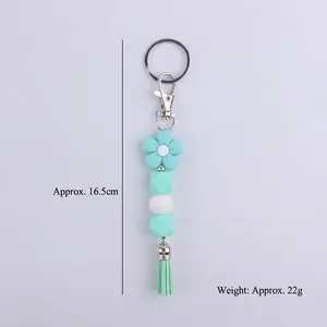 Mint green floral silicone bead keychain with tassel pendant and lobster clasp, 16.5cm length