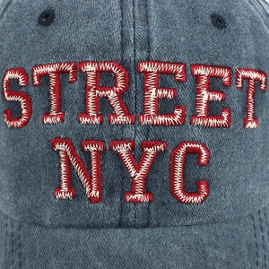 Washed navy blue cotton baseball cap with red and white STREET NYC embroidery and curved brim