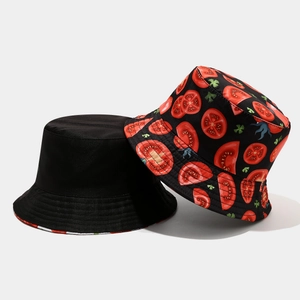 Detail showing high-density cotton canvas and tomato pattern on reversible bucket hat