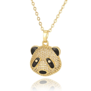 Sparkling gold panda pendant necklace featuring white cubic zirconia and black enamel accents