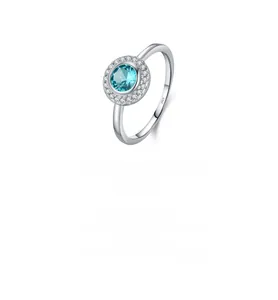 Macro view of S925 sterling silver ring with blue gemstone and micro-paved zircons